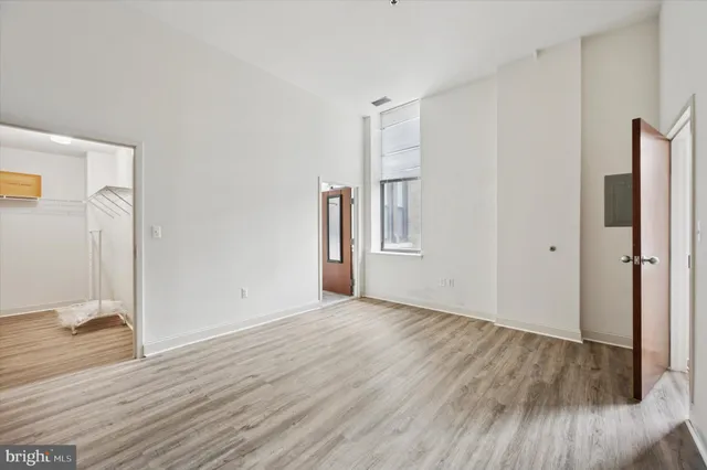 a view of a livingroom with wooden floor