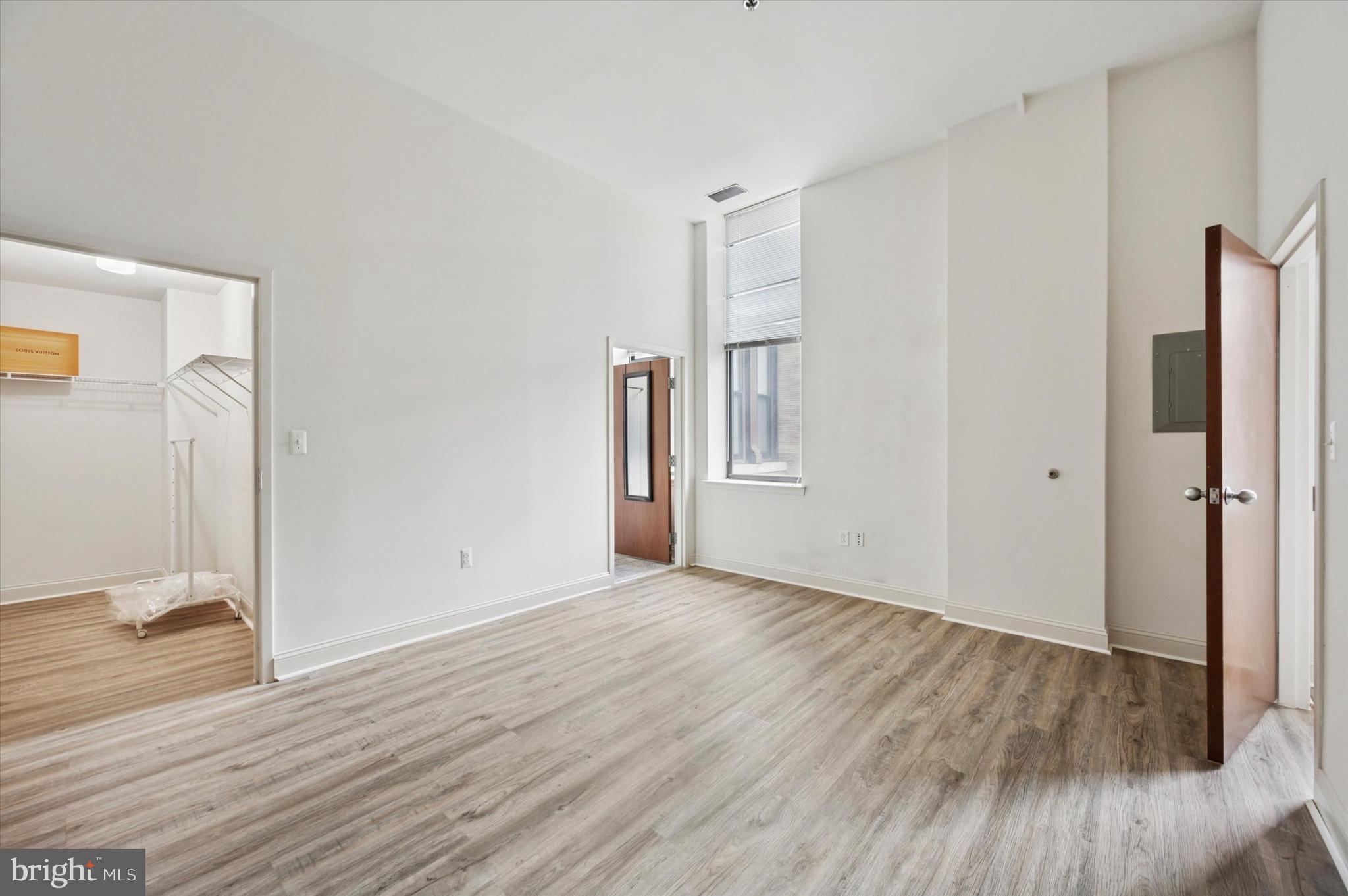 1001 Chestnut Street, Unit 904W Philadelphia, PA 19103 - Photo 19 of 25 a view of a livingroom with wooden floor