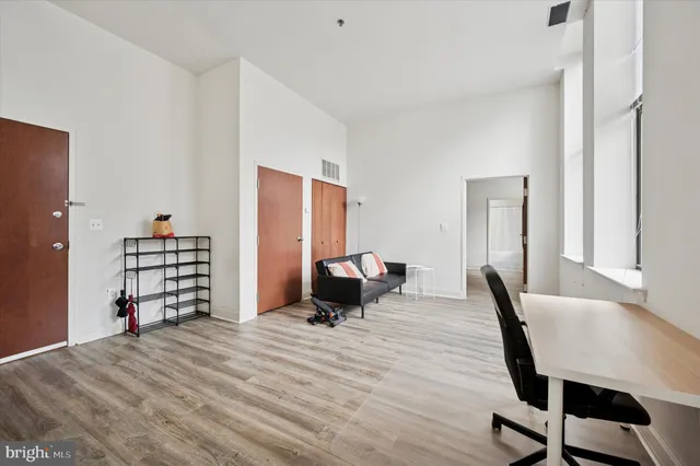 a room with a bed and furniture