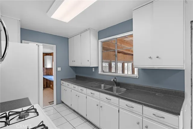 a kitchen with stainless steel appliances a stove a microwave and a refrigerator