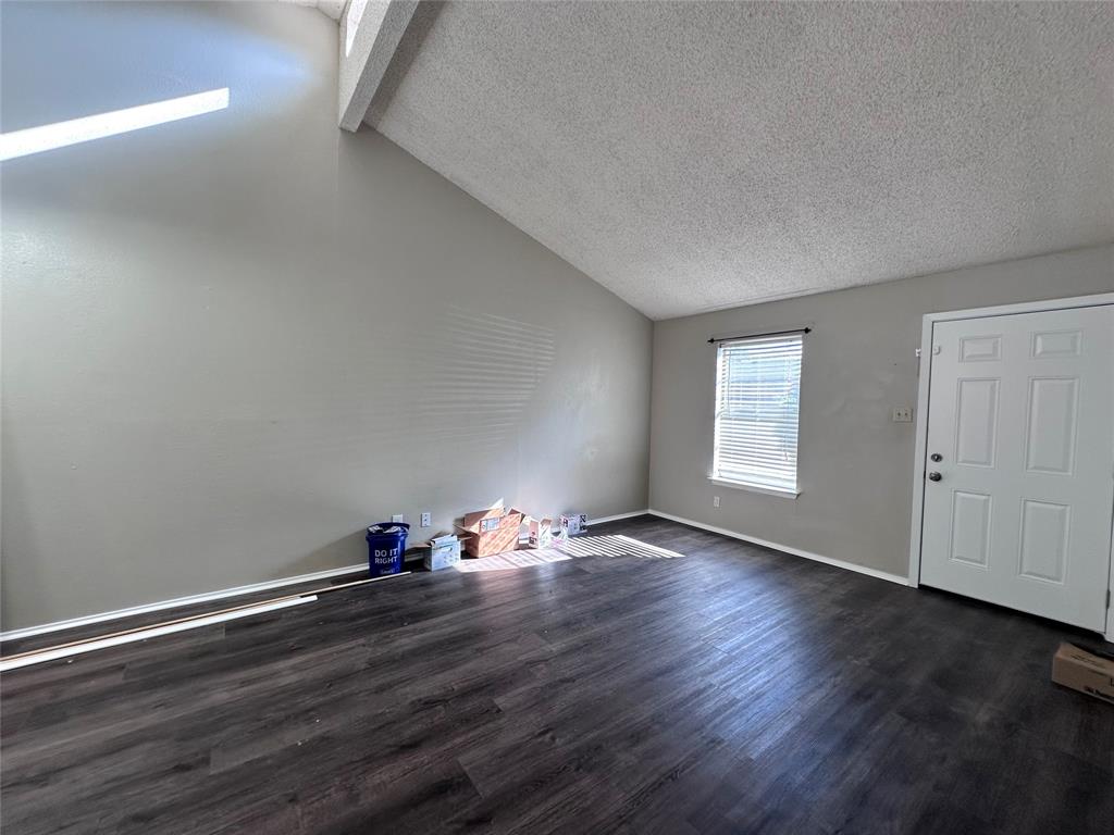 1110 B Lynn Street Weatherford, TX 76086 - Photo 2 of 8 a view of room with hardwood floor and window