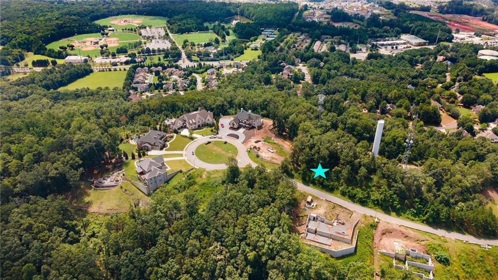 5005 Pindos Trail Southwest Powder Springs, GA 30127 - Photo 4 of 8 an aerial view of a house with yard swimming pool and outdoor seating