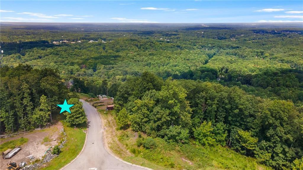 5005 Pindos Trail Southwest Powder Springs, GA 30127 - Photo 5 of 8 a view of a lake with a yard