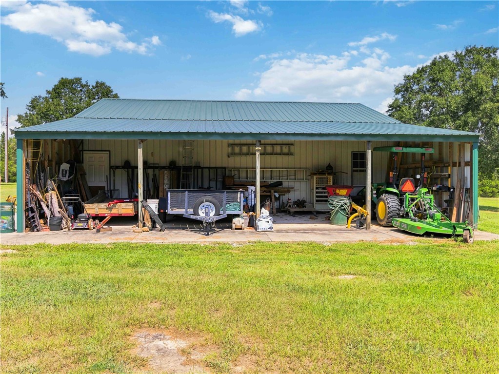 2861 Fairview Road Simpsonville, SC 29680 - Photo 34 of 42 An expansive metal outbuilding provides abundant sheltered workspace and covered storage options.