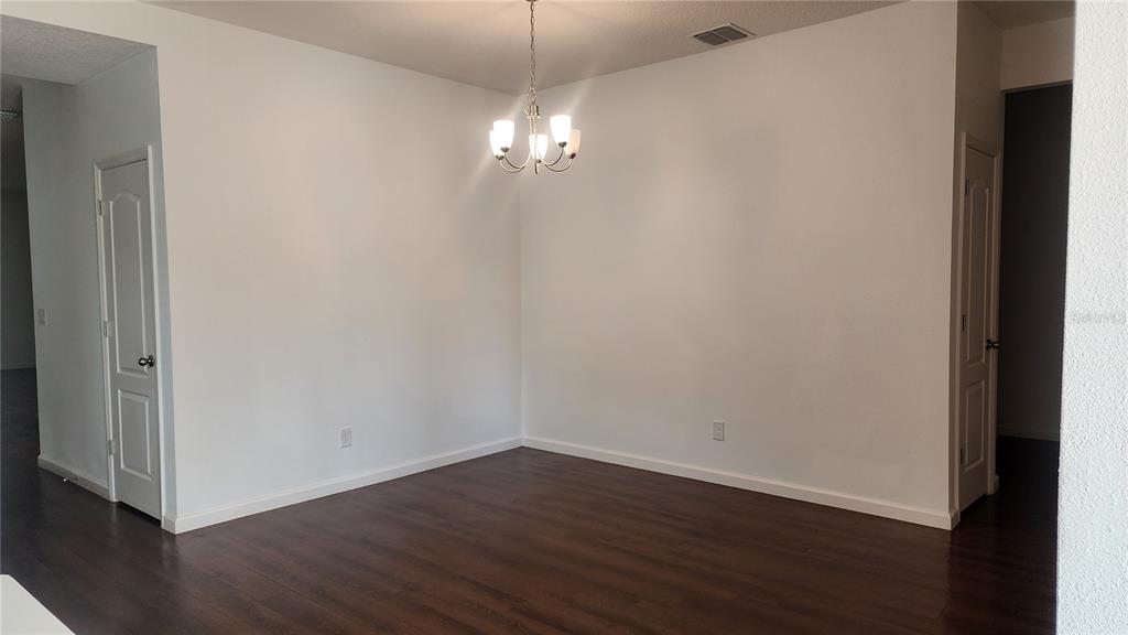 3230 Stratton Circle Kissimmee, FL 34744 - Photo 6 of 28 a view of a room with wooden floor