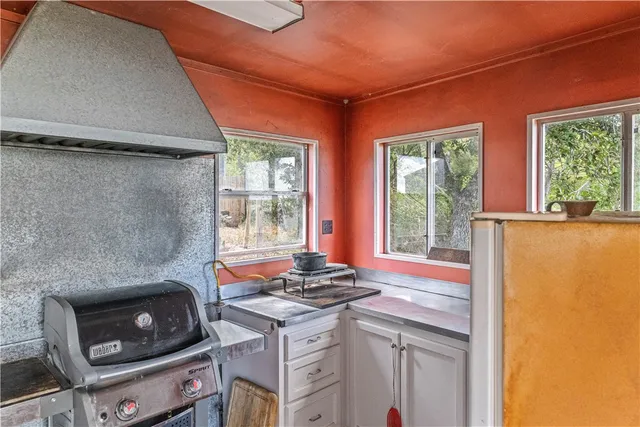 a kitchen that has a stove and a microwave