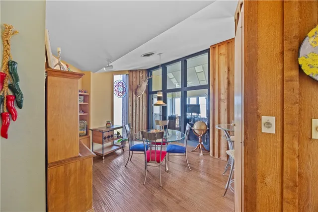 a living room filled with furniture and a large window