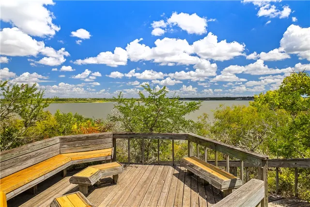 a view of a balcony with wooden floor