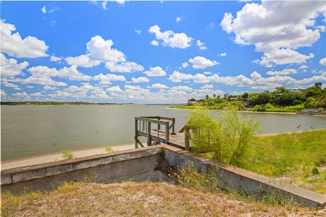 a view of a lake and sunset