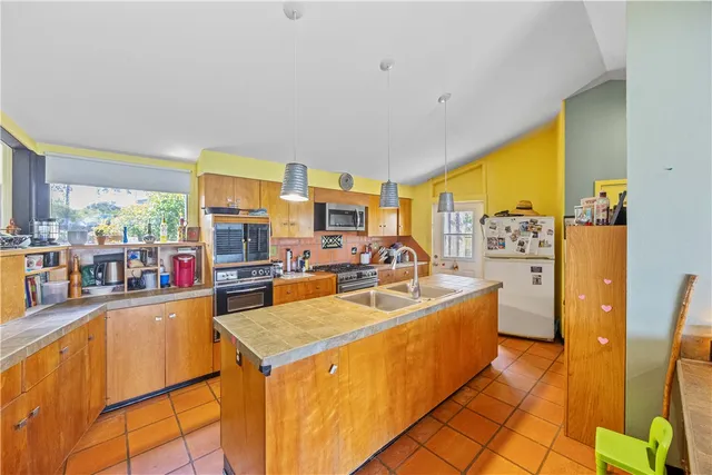 a view of a kitchen with a large window