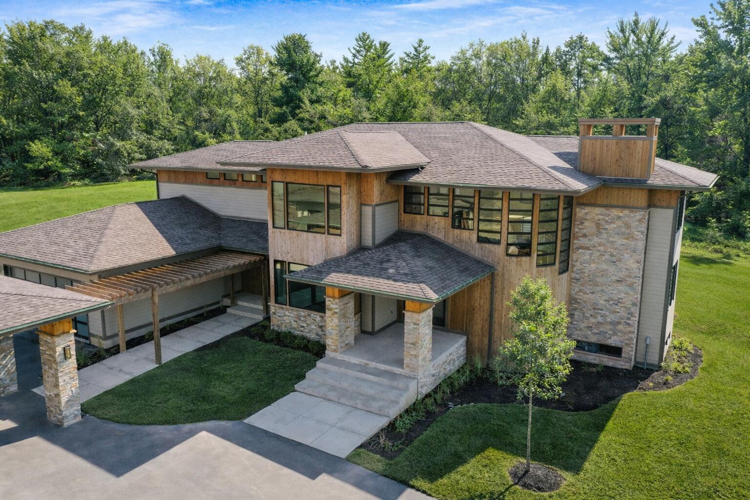 885 North 100 West Valparaiso, IN 46385 - Photo 1 of 65 a aerial view of a house with a yard table and chairs