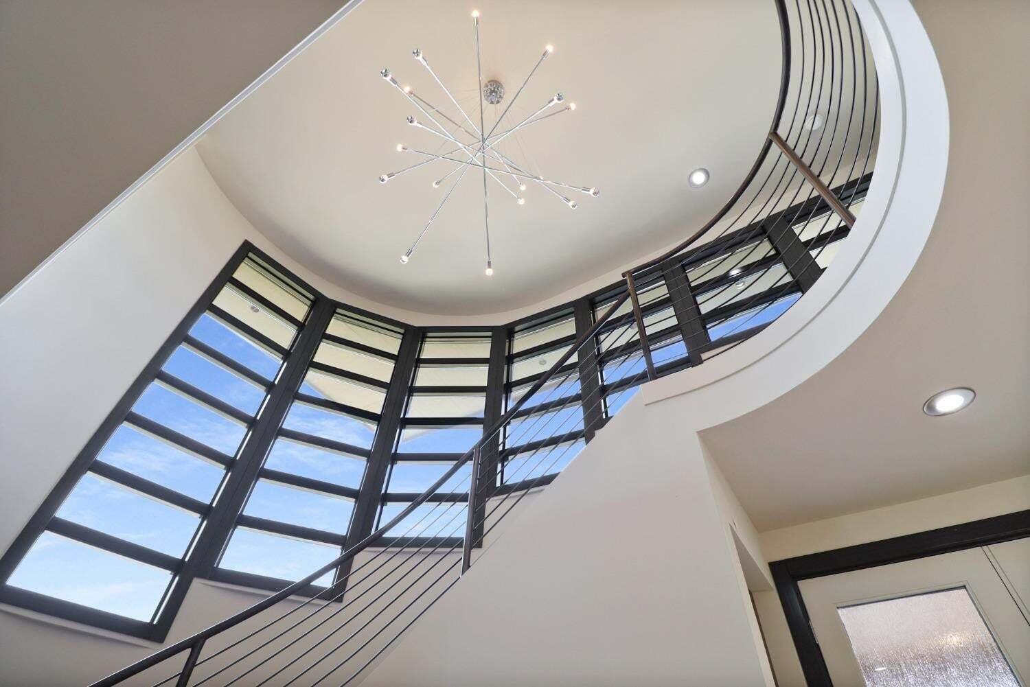 885 North 100 West Valparaiso, IN 46385 - Photo 6 of 65 a view of staircase with a large window and a chandelier