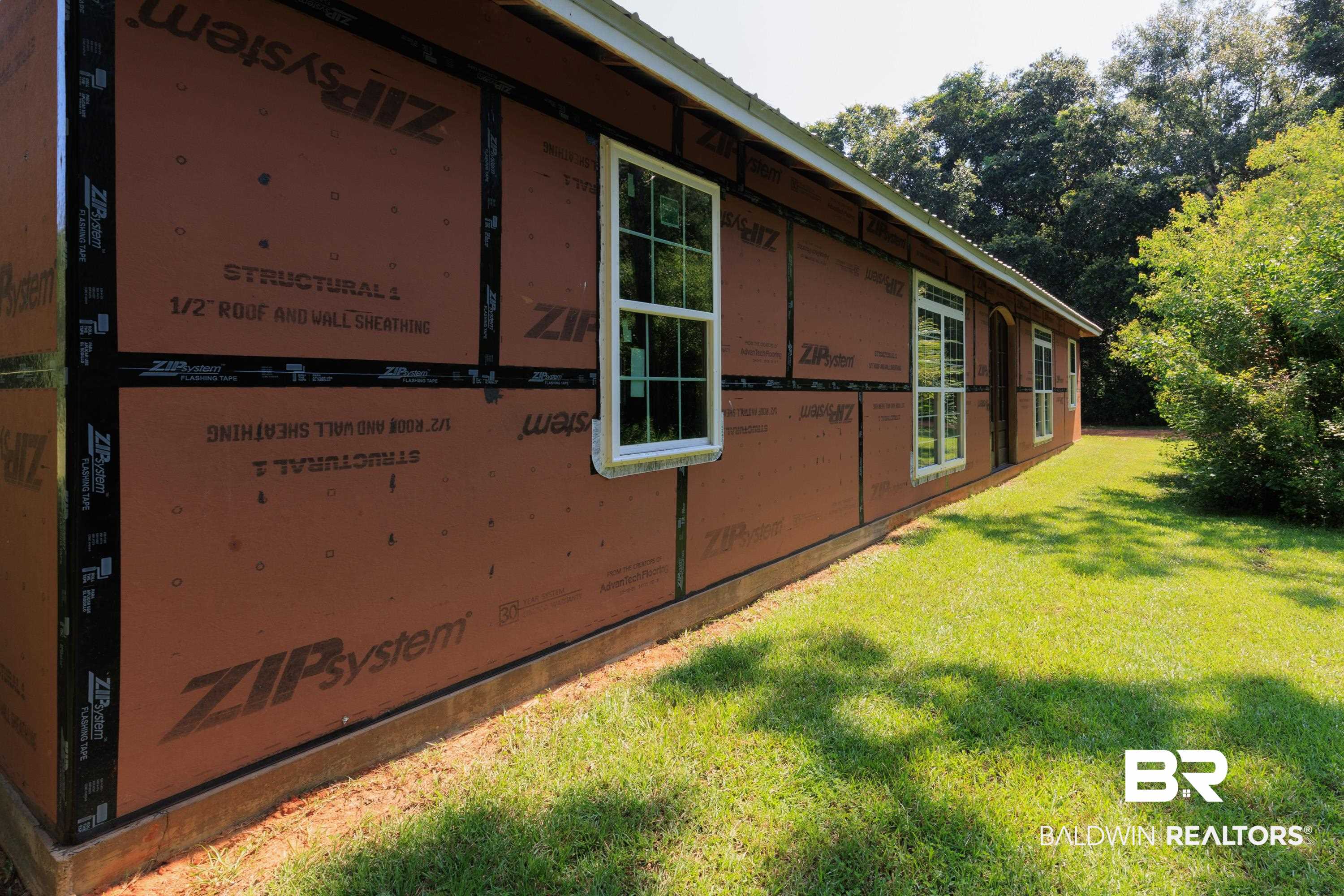 17385 County Road 16 Foley, AL 36535 - Photo 53 of 53 View of home's exterior featuring a yard and metal roof