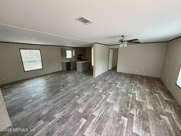 a view of a livingroom with wooden floor
