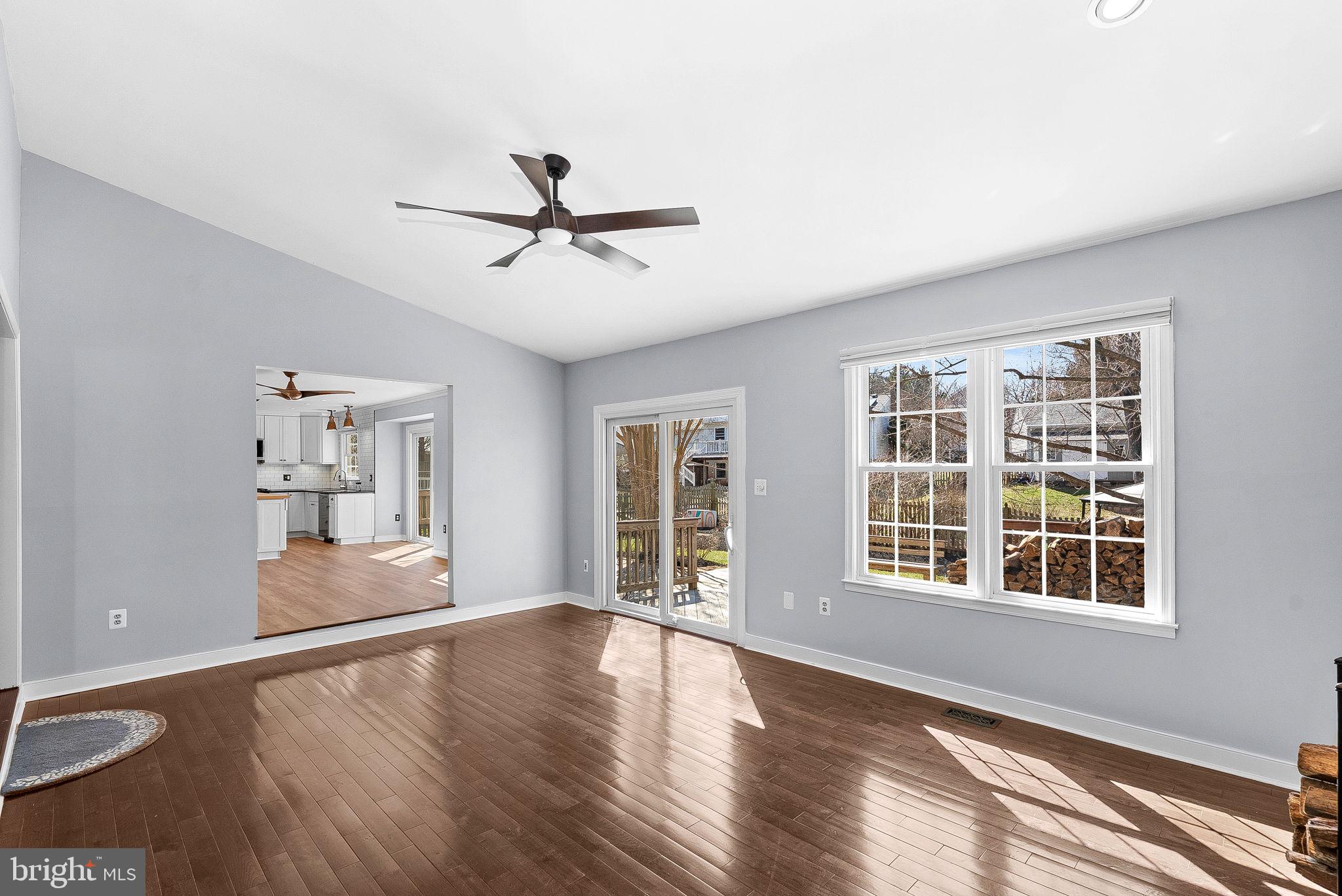 105 Country Road Sterling, VA 20165 - Photo 11 of 49 a view of an empty room with a window and wooden floor
