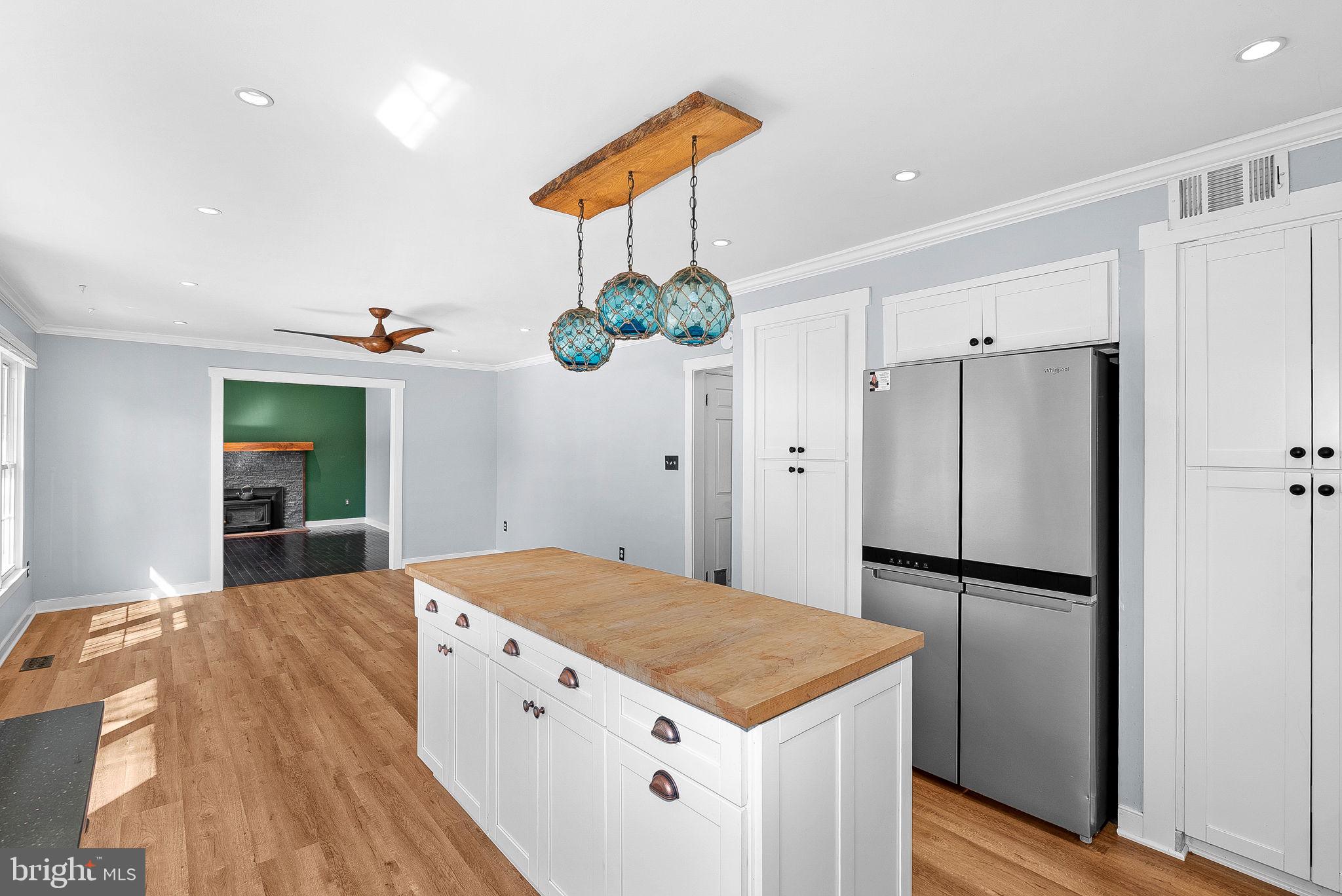 105 Country Road Sterling, VA 20165 - Photo 15 of 49 a kitchen with a refrigerator and countertop