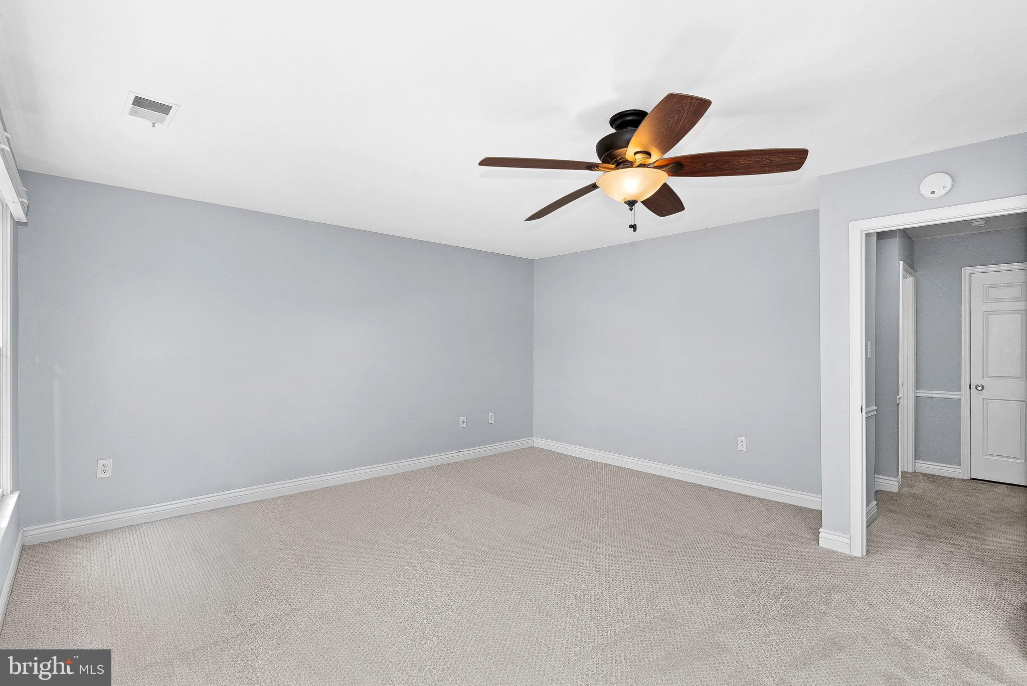 105 Country Road Sterling, VA 20165 - Photo 22 of 49 a view of room with a ceiling fan and window