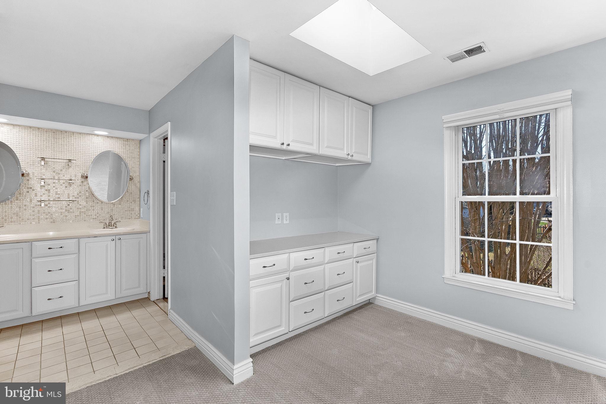 105 Country Road Sterling, VA 20165 - Photo 25 of 49 a room with cabinets and window