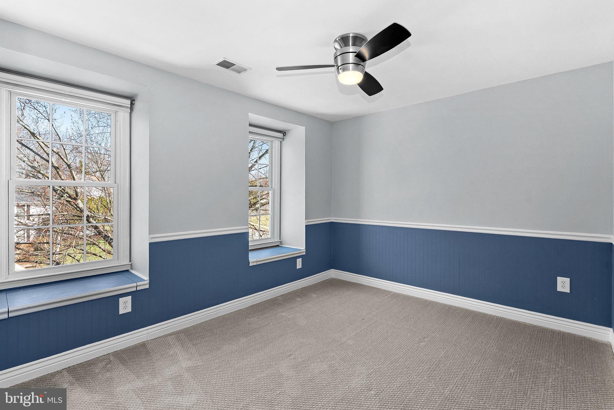 105 Country Road Sterling, VA 20165 - Photo 27 of 49 an empty room with windows and fan