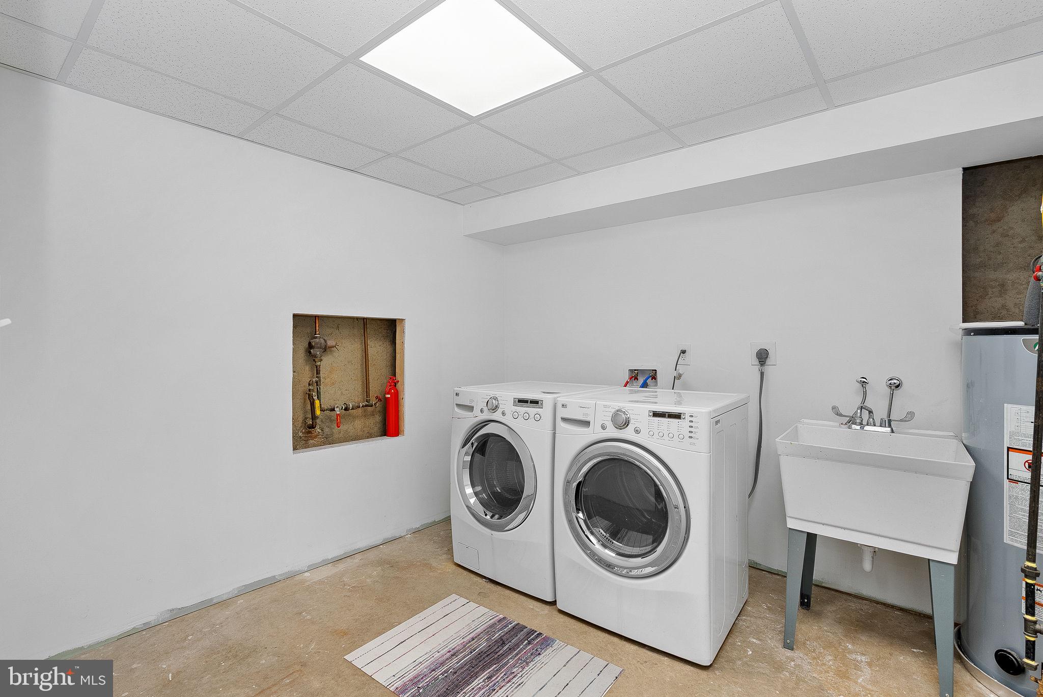 105 Country Road Sterling, VA 20165 - Photo 29 of 49 a utility room with dryer and washer
