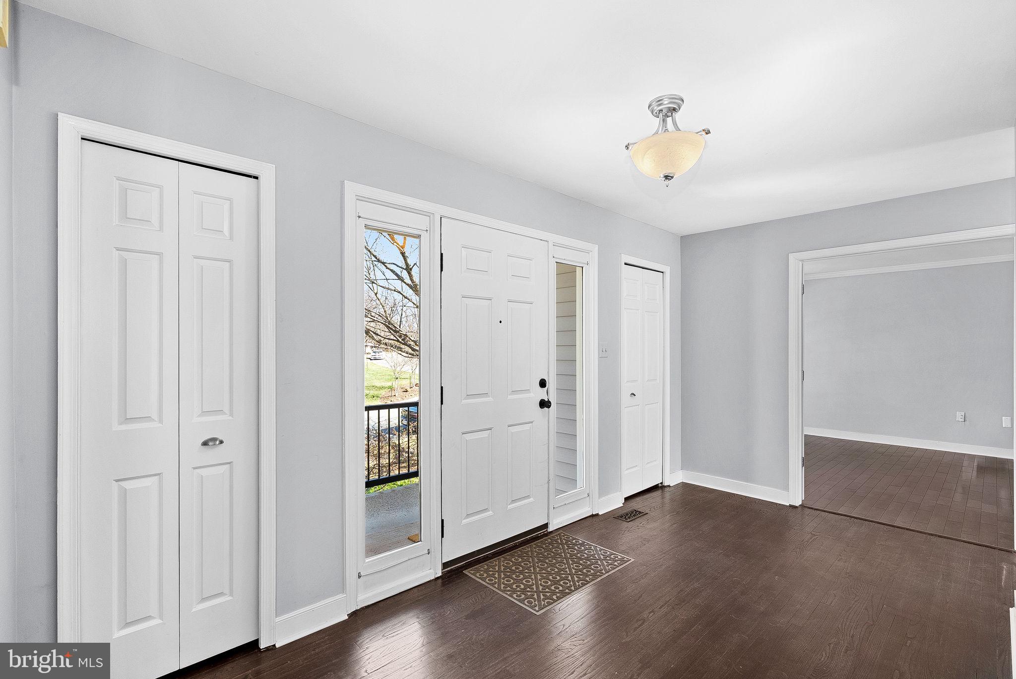 105 Country Road Sterling, VA 20165 - Photo 3 of 49 a view of an empty room with wooden floor