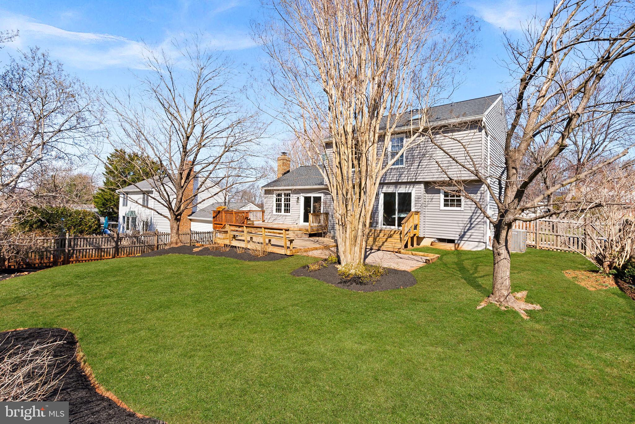 105 Country Road Sterling, VA 20165 - Photo 33 of 49 a view of a yard with a house and a large tree