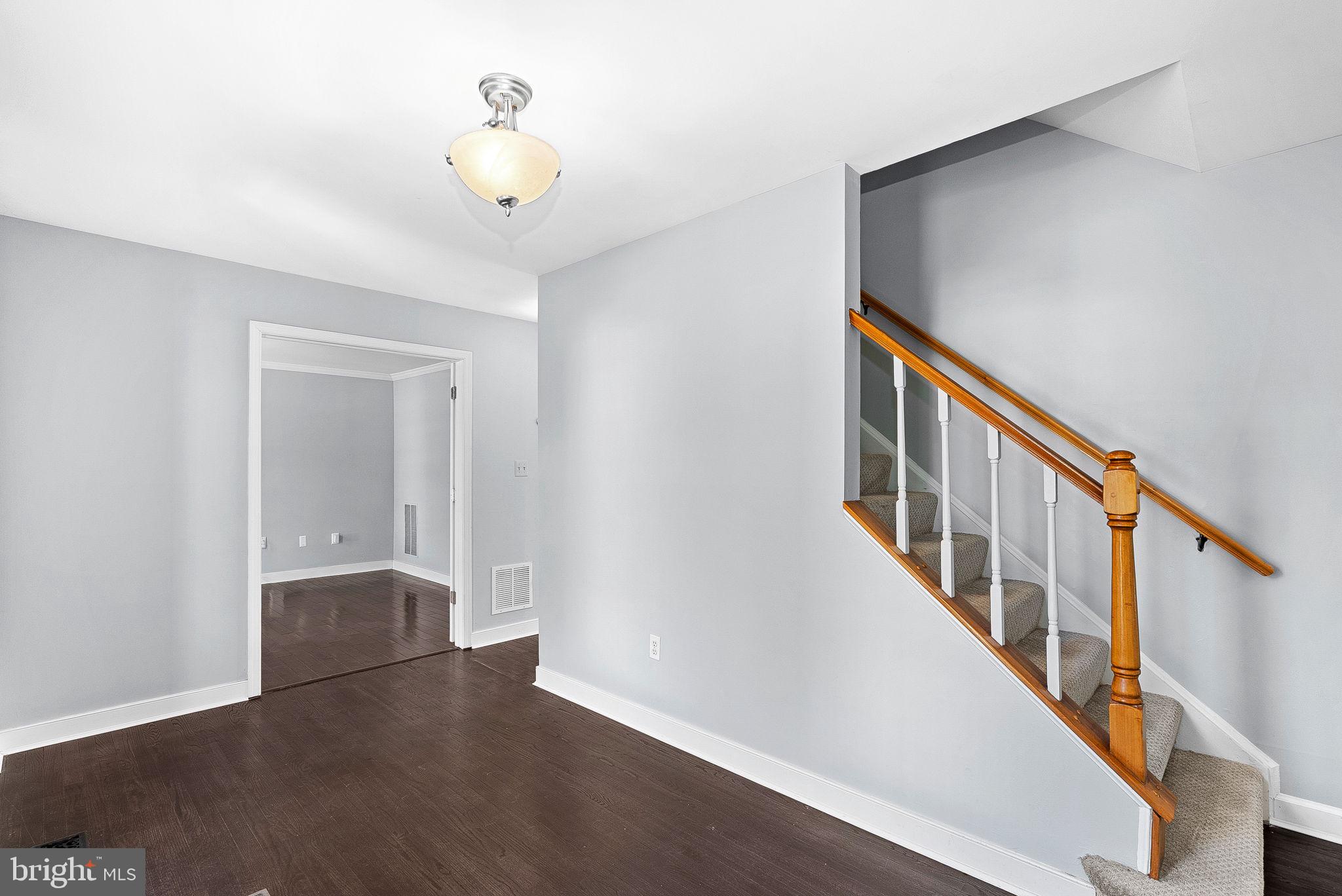 105 Country Road Sterling, VA 20165 - Photo 4 of 49 a view of an entryway with wooden floor
