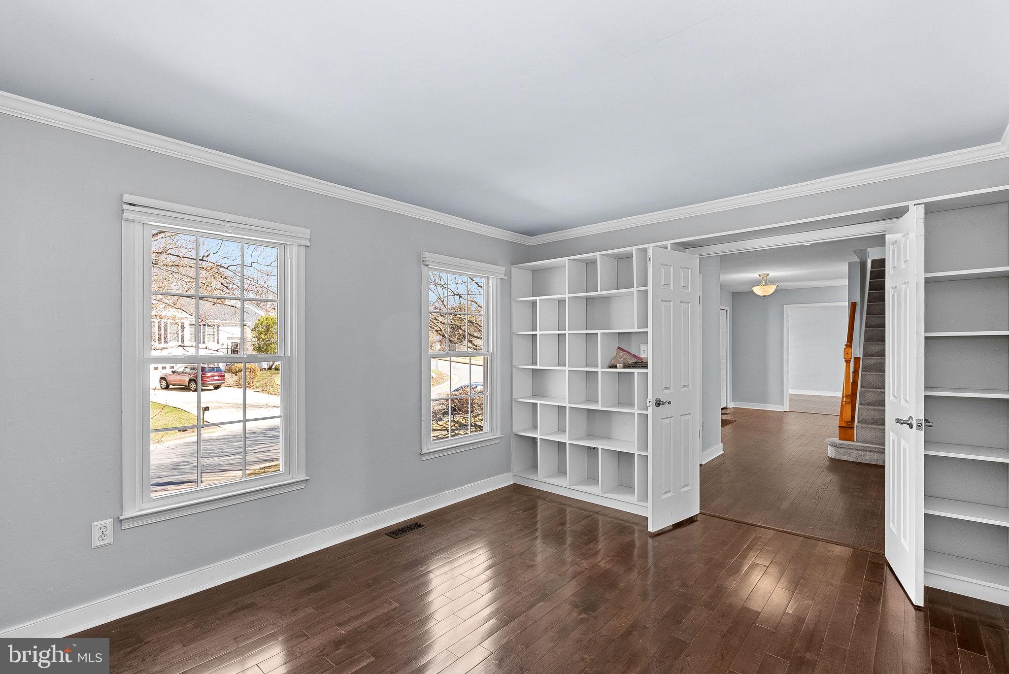 105 Country Road Sterling, VA 20165 - Photo 8 of 49 wooden floor in an empty room with a window