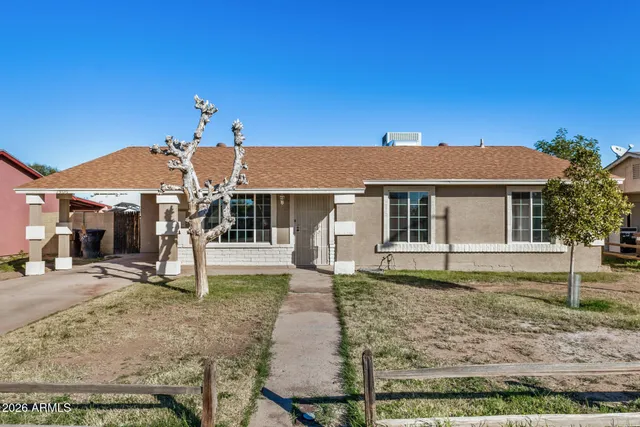 front view of a house with a yard