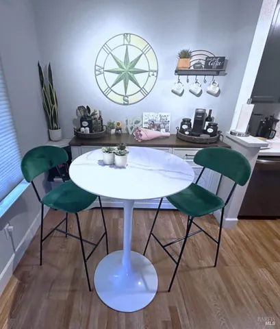 a view of a dining room with furniture wooden floor and chandelier