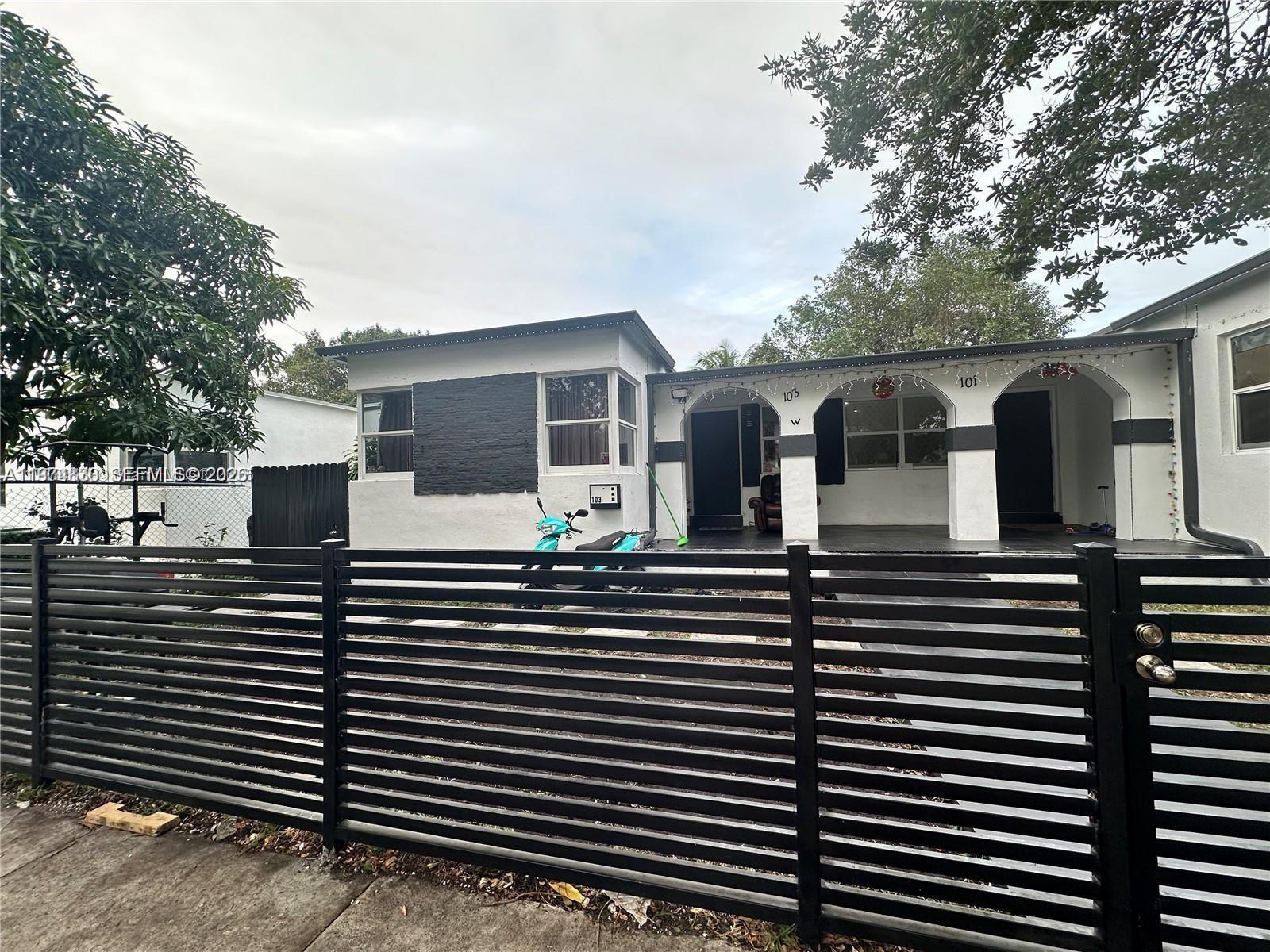 101 Northwest 68th Terrace Miami, FL 33150 - Photo 3 of 5 a view of a house with backyard