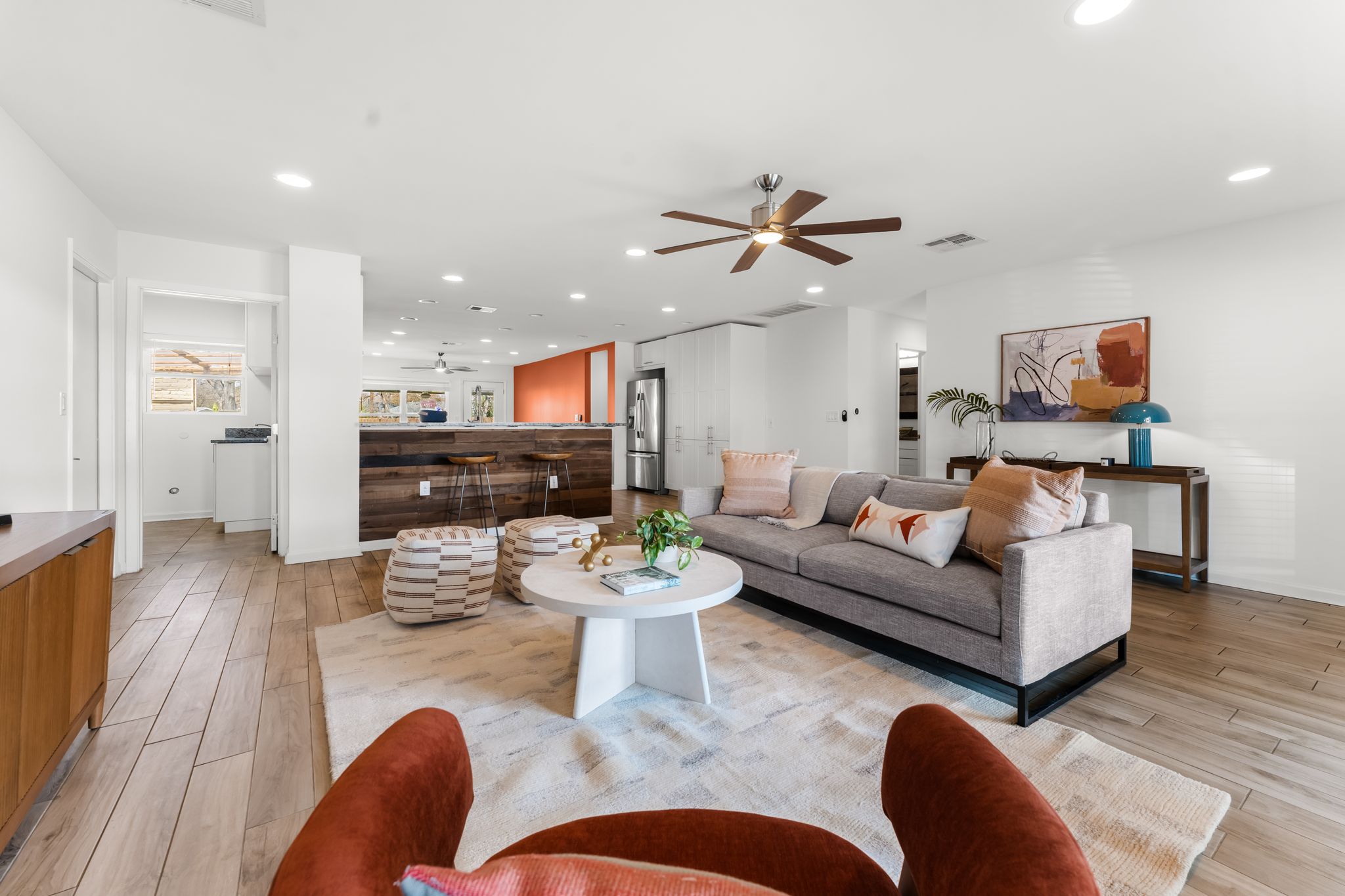 1900 Ohlen Road Austin, TX 78757 - Photo 6 of 34 a living room with furniture kitchen view and a fireplace