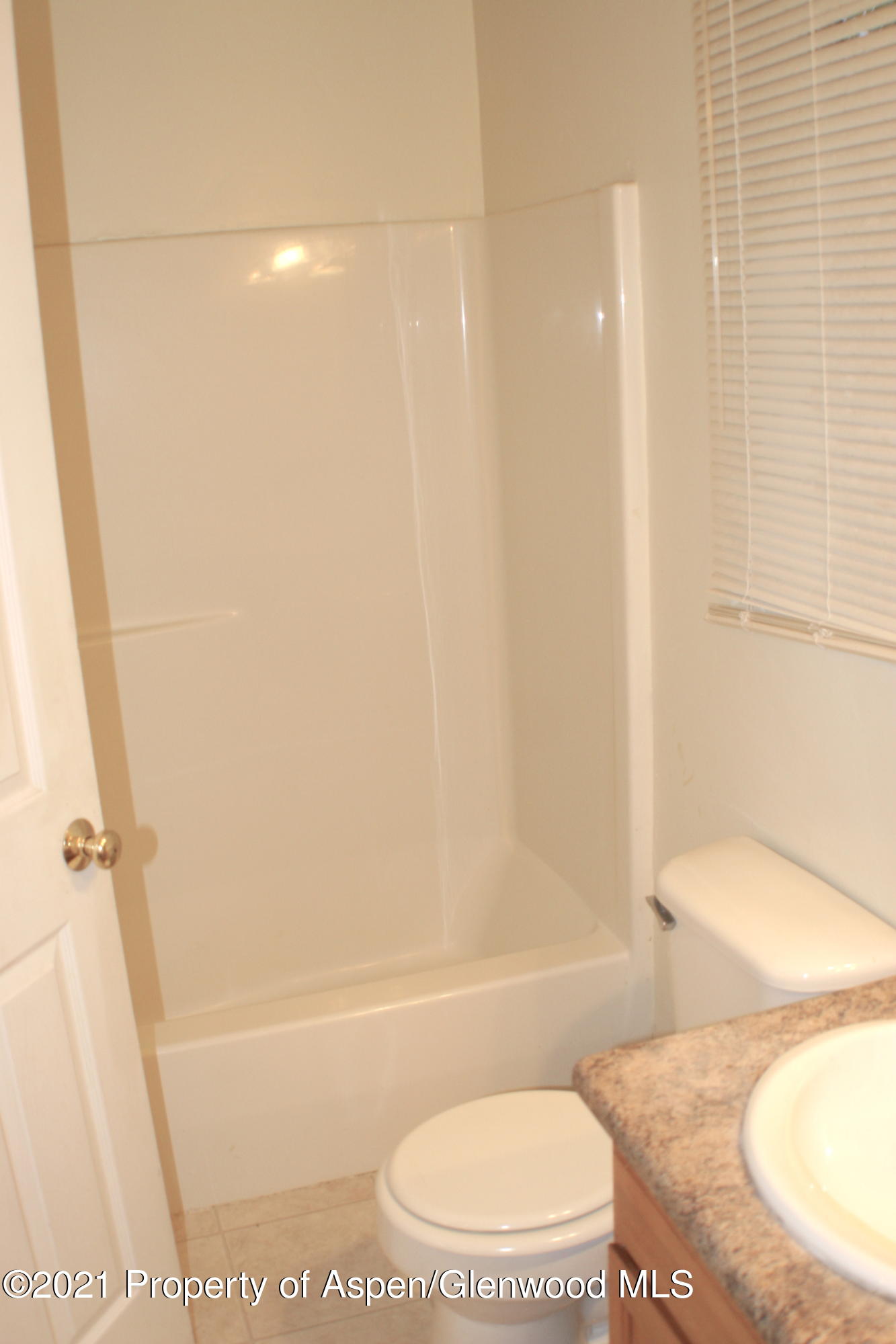 3169 West 31st Court Rifle, CO 81650 - Photo 15 of 27 a bathroom with a toilet and a shower