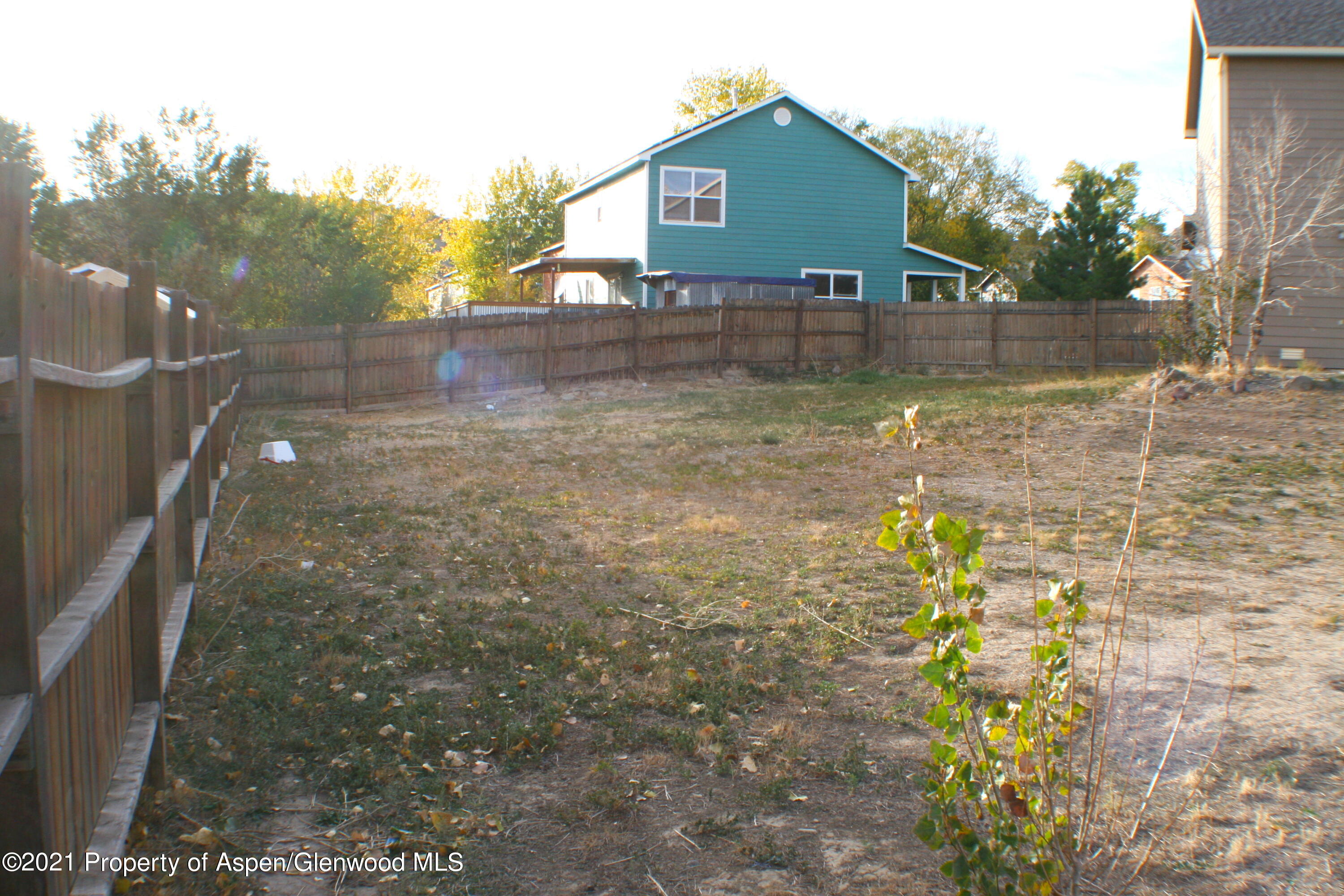 3169 West 31st Court Rifle, CO 81650 - Photo 22 of 27 a view of a yard with wooden fence