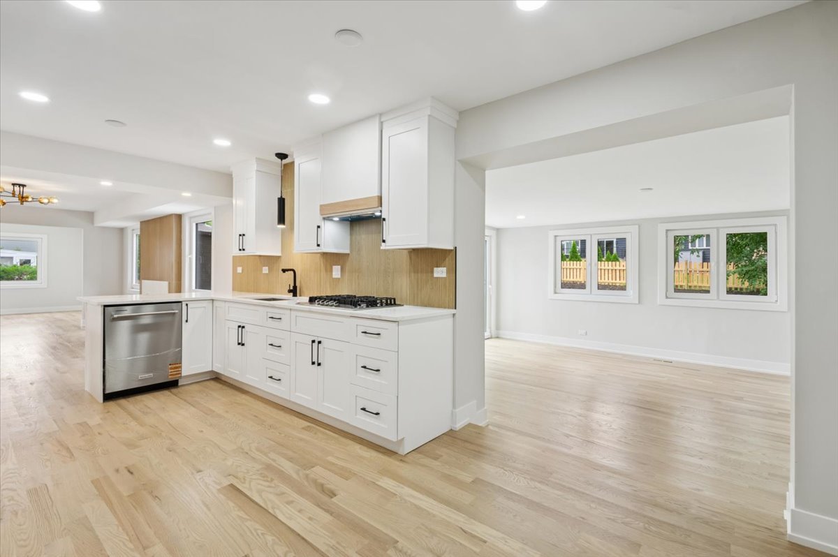 303 Cedarbrook Road Naperville, IL 60565 - Photo 14 of 30 a kitchen with stainless steel appliances a refrigerator sink and cabinets
