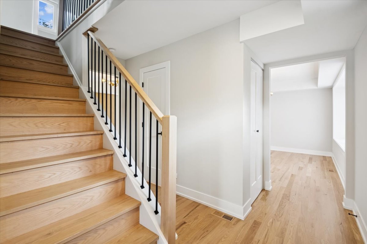 303 Cedarbrook Road Naperville, IL 60565 - Photo 20 of 30 a view of a hallway with wooden floor and entryway