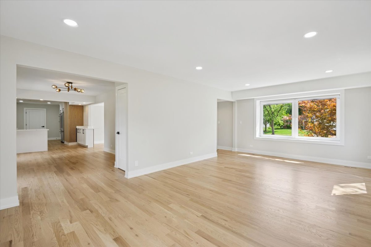 303 Cedarbrook Road Naperville, IL 60565 - Photo 2 of 30 wooden floor in an empty room with a window