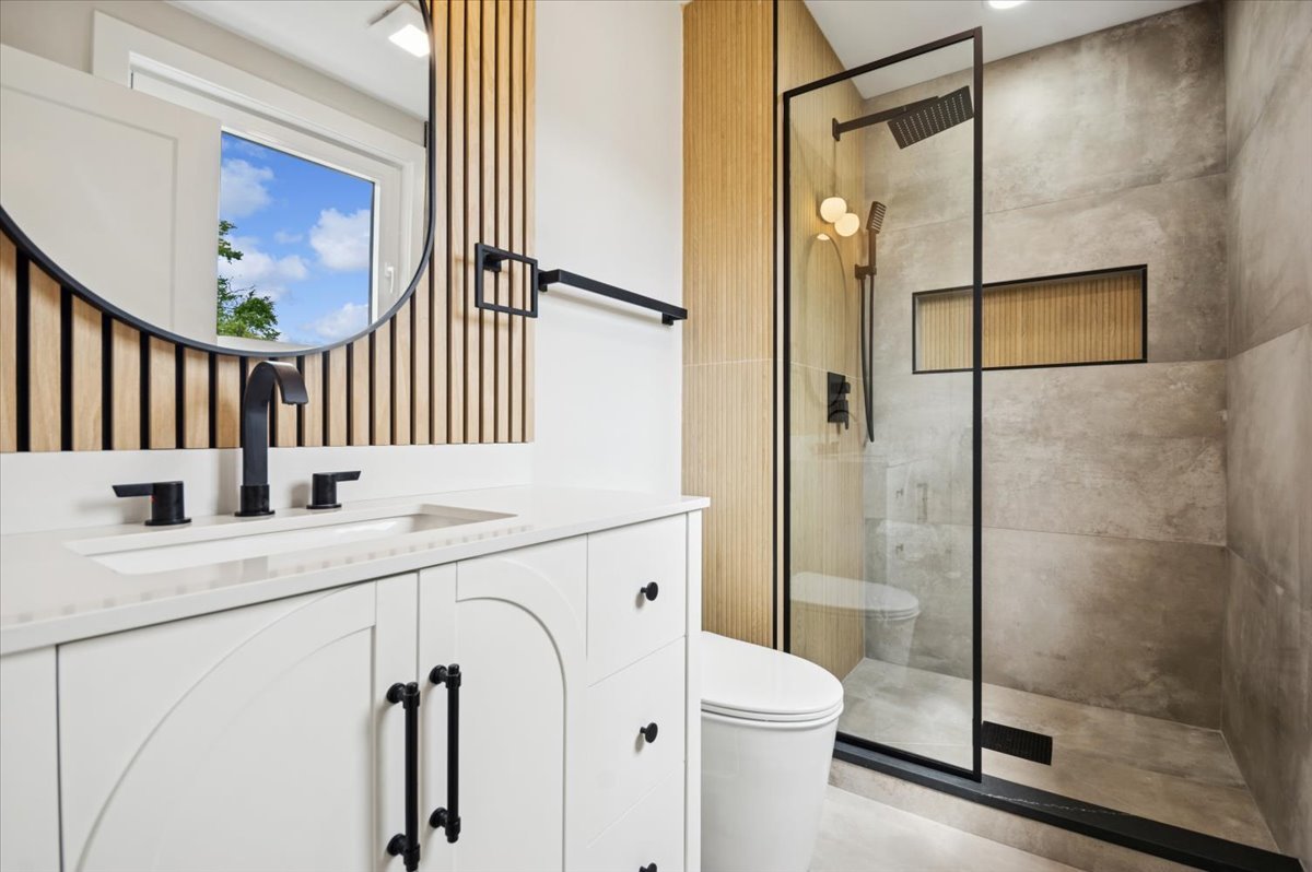 303 Cedarbrook Road Naperville, IL 60565 - Photo 23 of 30 a bathroom with a granite countertop sink mirror and toilet
