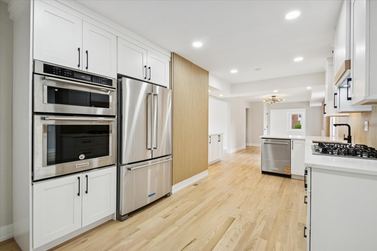 303 Cedarbrook Road Naperville, IL 60565 - Photo 10 of 30 a kitchen with stainless steel appliances a refrigerator sink and stove