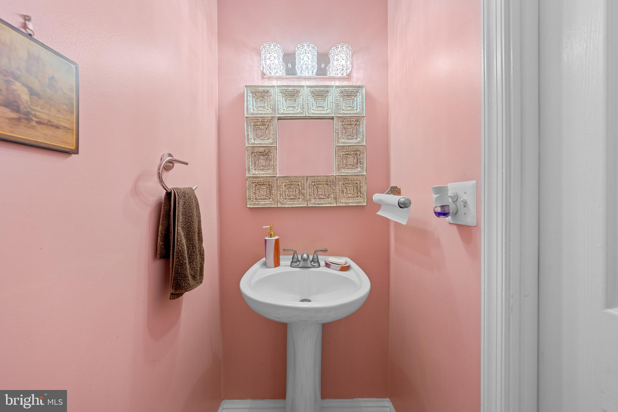 2829 Grovemore Lane Vienna, VA 22180 - Photo 37 of 42 Charming pink-hued powder room oasis.