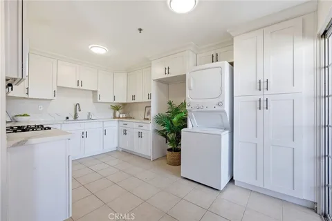 a kitchen with cabinets and white appliances