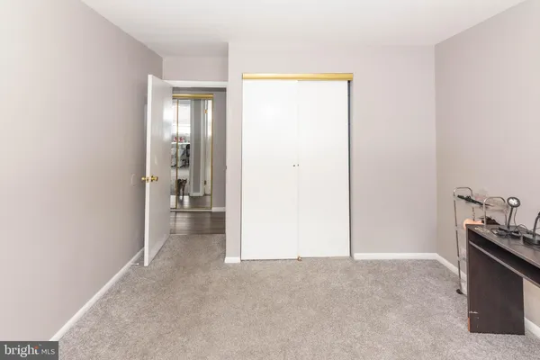 a view of a room that has a bench in it