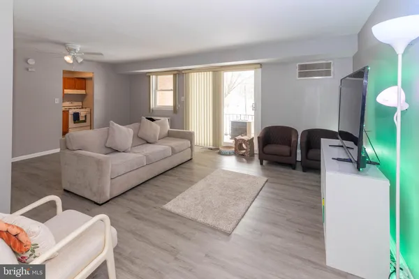 a living room with furniture and a window