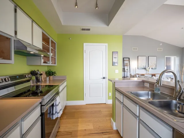 a kitchen that has a sink and a stove