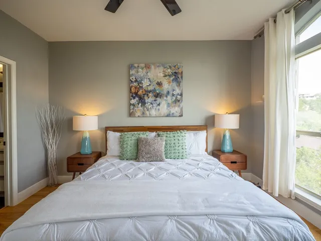 a bedroom with a bed and a window