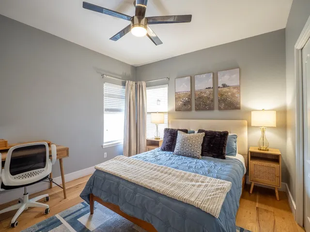 a bedroom with a bed and a chair