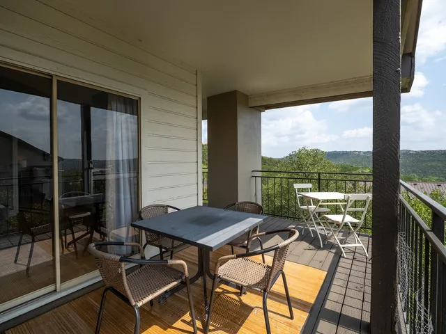 a view of an outdoor space with furniture and garden