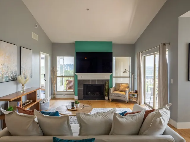 a living room with furniture and a fireplace
