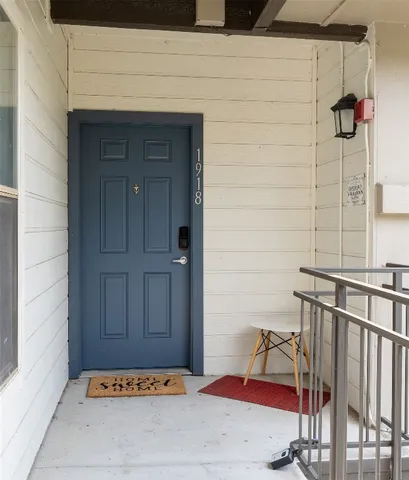 a view of a door and chair