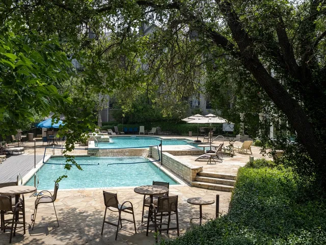 a view of a table and chairs in patio of the house